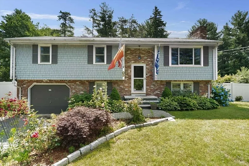 Ranch-style house with landscaped yard.